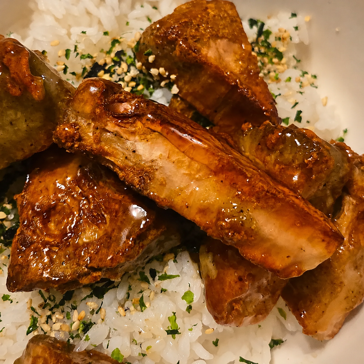 Fried jackfruit with orange sauce served over seasoned white rice